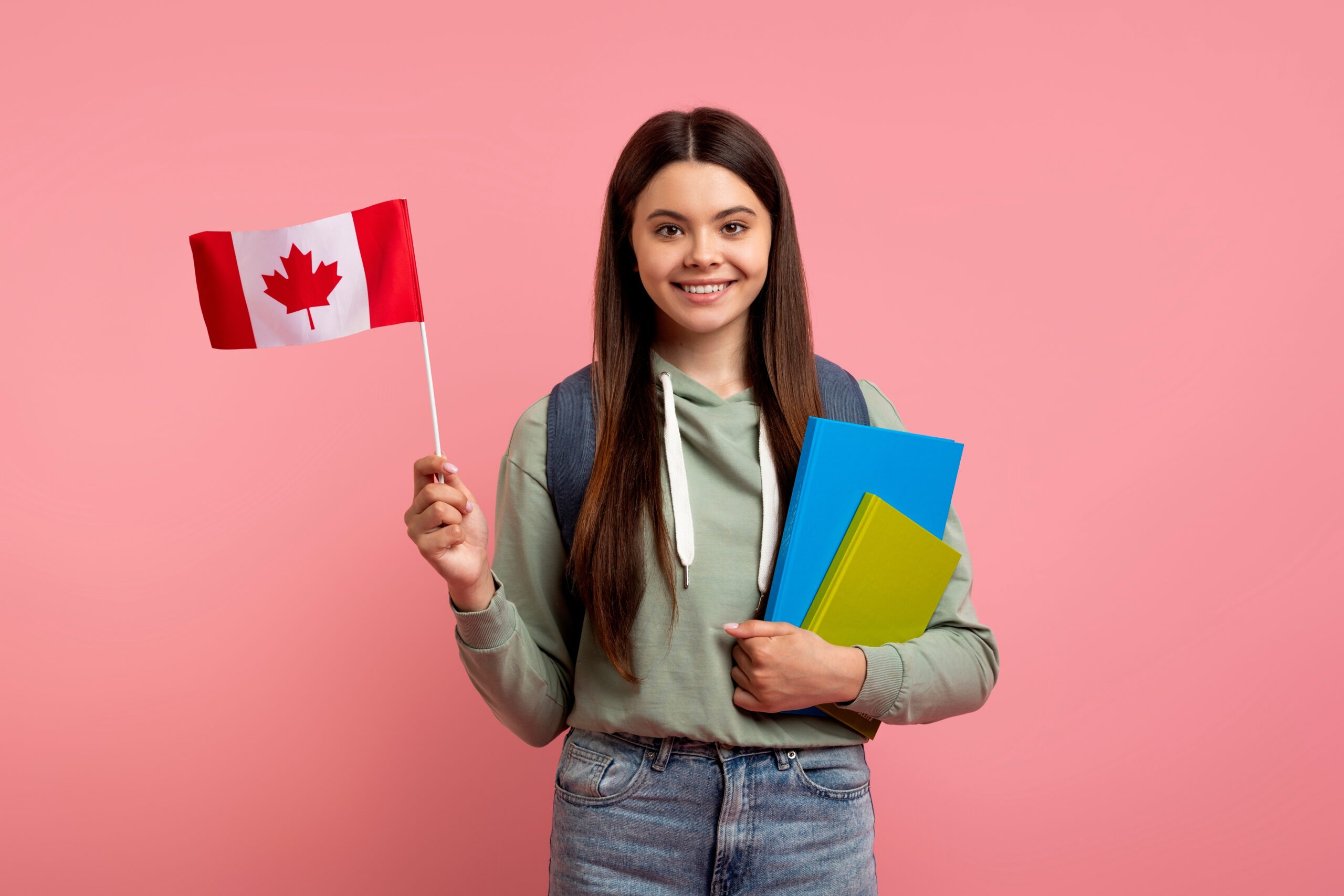 Study,Abroad.,Beautiful,Teen,Girl,Holding,Flag,Of,Canada,And